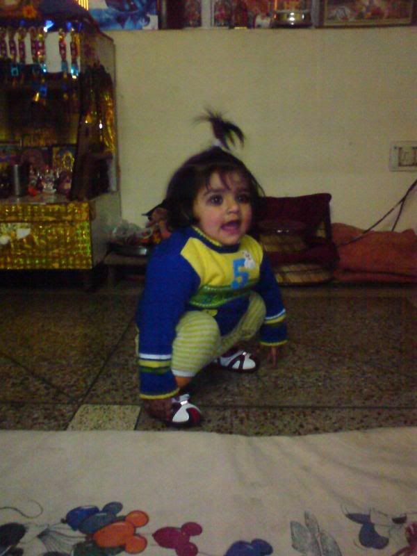 Cute baby girl playing in room