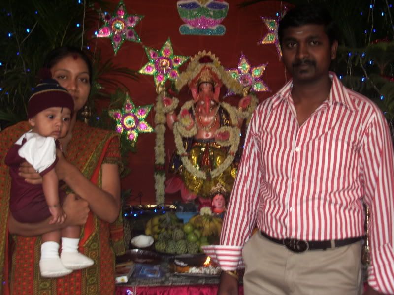 Cute baby with their parant in temple of God Ganesh