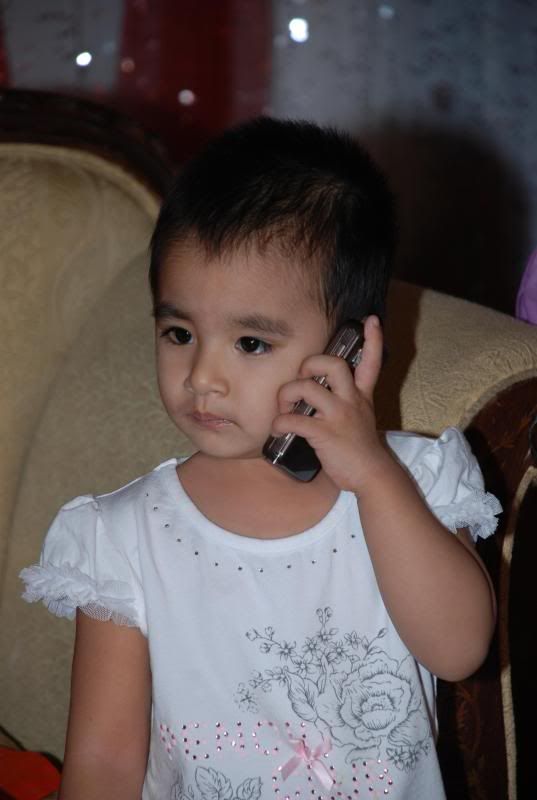 Cute baby talking in mobile