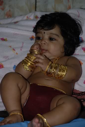 Cute baby playing with bangles