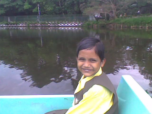 Cute Boy playing in boat